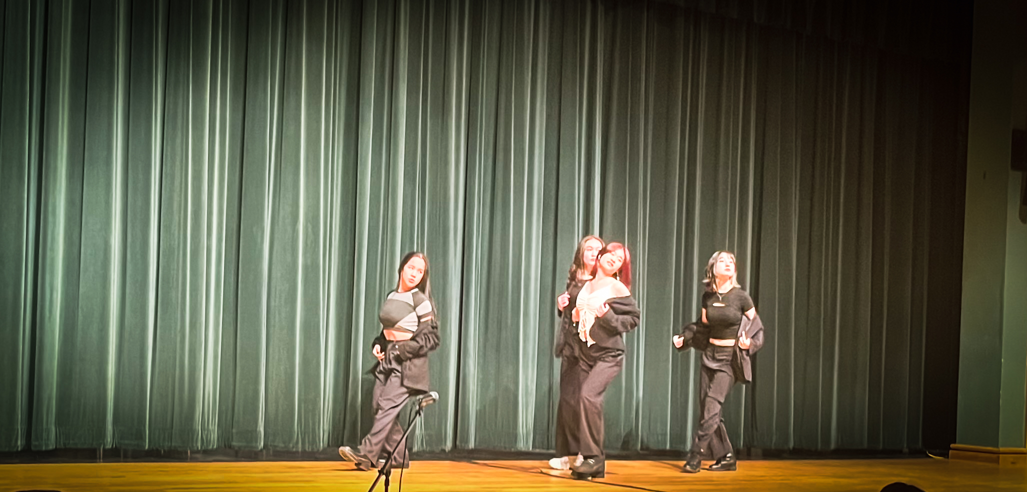 Juniors Grace Losada, Natalie Bouffard, Amanda Xie, and Abigail Baskin perform a K-Pop dance.