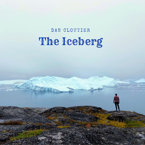 Man looking at an iceberg
