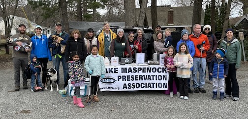 Lots of people with a sign for Lake Maspenock