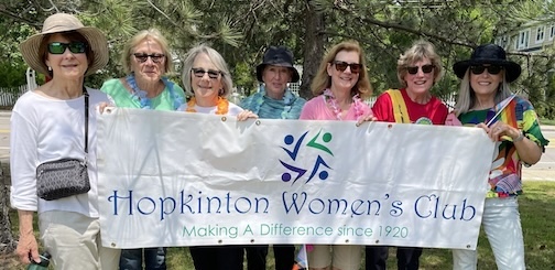 Women holding sign