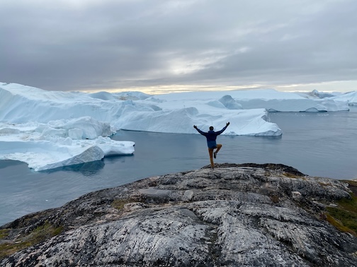Yoga looking at an iceberg