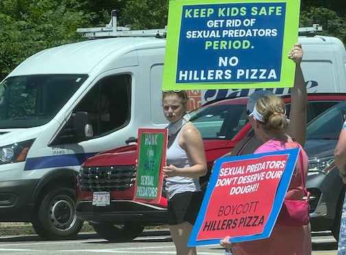 People picketing Hiller's Pizza