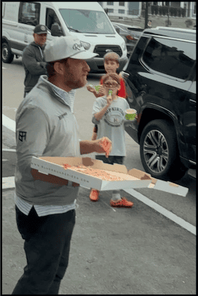 Man with a pizza box