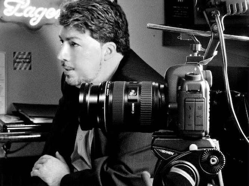 Man next to a camera.