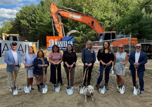 group pf people holding shovels at a ground breaking for Baypath