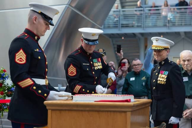 Celebrating Marine Heritage: cutting the cake with a sword commemoratees the 250th year of the marine corps.